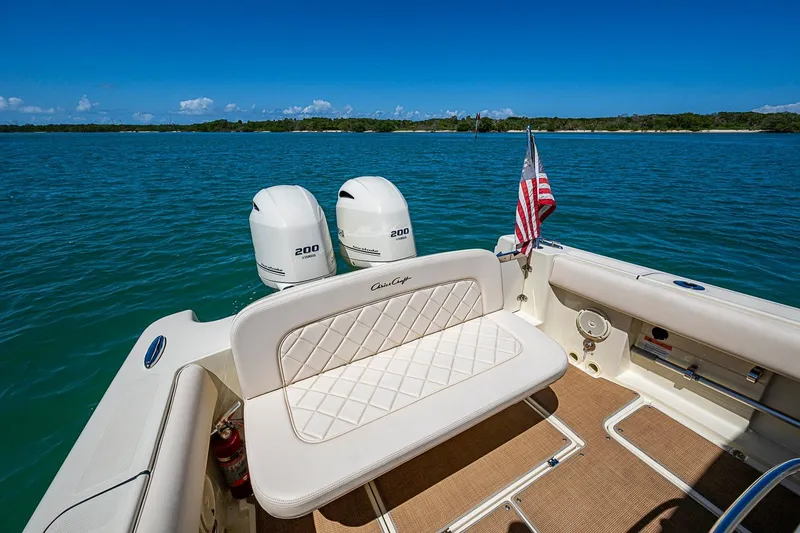 Slide: The Image of 2017 Chris-Craft Catalina 26 boat with twin engines on a sunny day. - 18