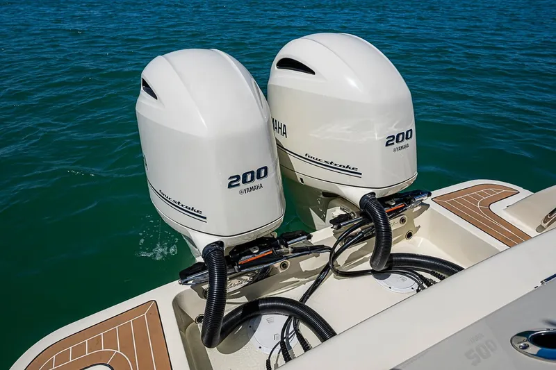 Slide: The Image of 2017 Chris-Craft Catalina 26 with twin Yamaha 200 outboard engines on blue water. - 21