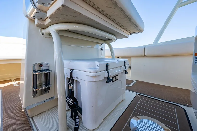 Slide: The Image of 2017 Chris-Craft Catalina 26 boat interior with Yeti cooler and seating area. - 9
