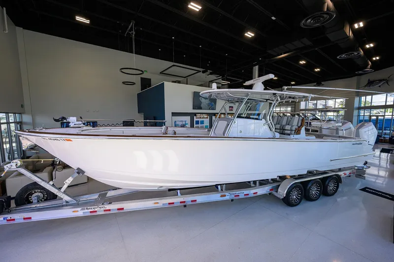 The Image of 2025 Valhalla Boatworks V-37 on trailer in showroom, showcasing sleek design and modern features. - 0