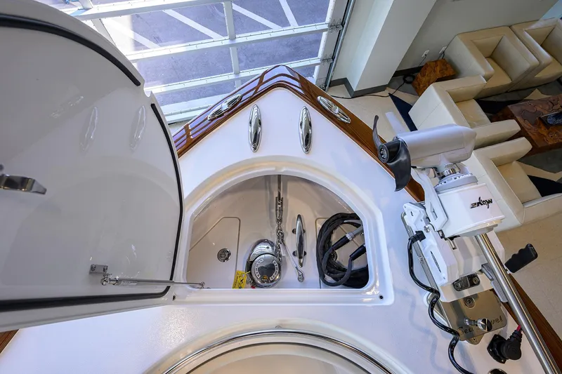 Slide: The Image of 2025 Valhalla Boatworks V-37 anchor compartment with equipment and seating area. - 10
