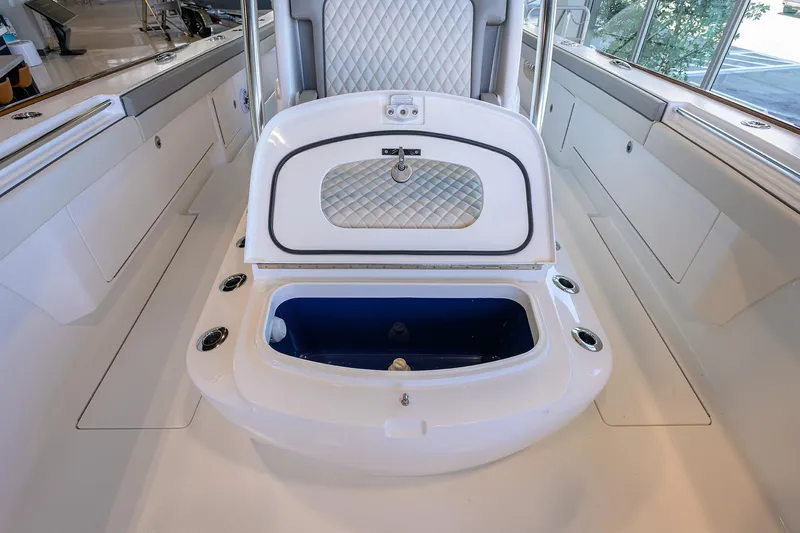Slide: The Image of 2025 Valhalla Boatworks V-37 interior with open storage compartment and sleek design. - 12