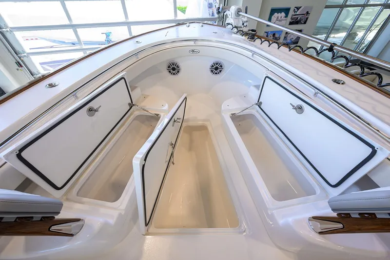 Slide: The Image of 2025 Valhalla Boatworks V-37 interior storage compartments, open hatches, sleek design. - 13