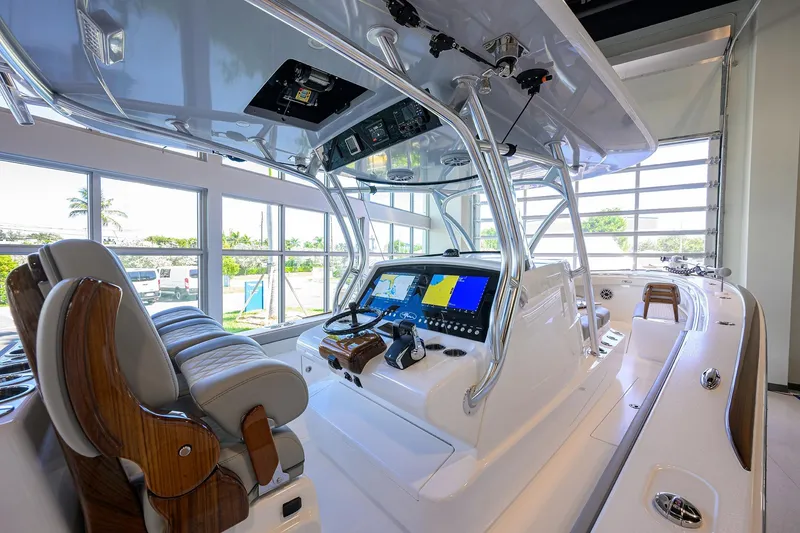 Slide: The Image of 2025 Valhalla Boatworks V-37 interior with advanced navigation system and luxurious seating. - 16