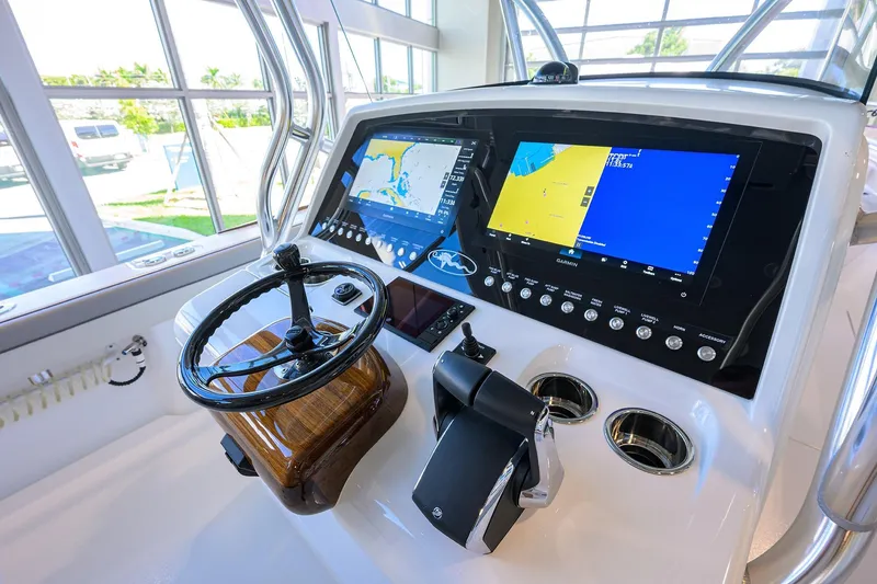 Slide: The Image of 2025 Valhalla Boatworks V-37 helm with advanced navigation displays and controls. - 17