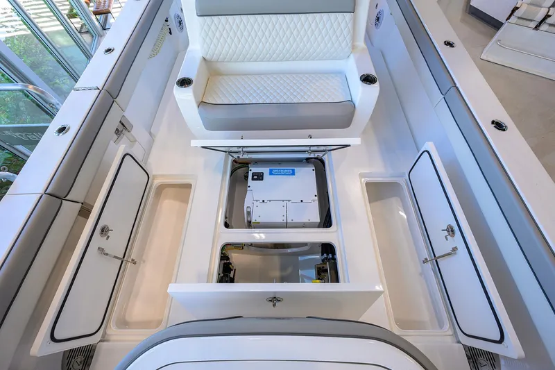 Slide: The Image of 2025 Valhalla Boatworks V-37 interior with open storage compartments and seating. - 22