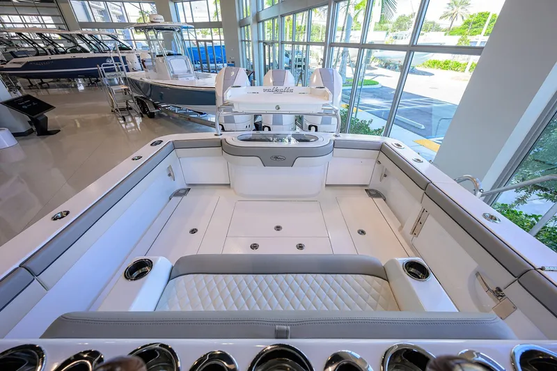Slide: The Image of 2025 Valhalla Boatworks V-37 interior, showcasing sleek design and luxurious seating in a showroom. - 25