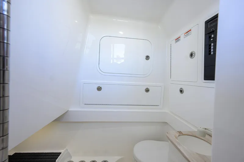Slide: The Image of 2025 Valhalla Boatworks V-37 interior bathroom with white cabinetry and modern fixtures. - 32