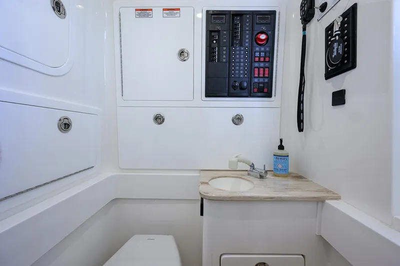 Slide: The Image of 2025 Valhalla Boatworks V-37 interior with control panel, sink, and storage compartments. - 33
