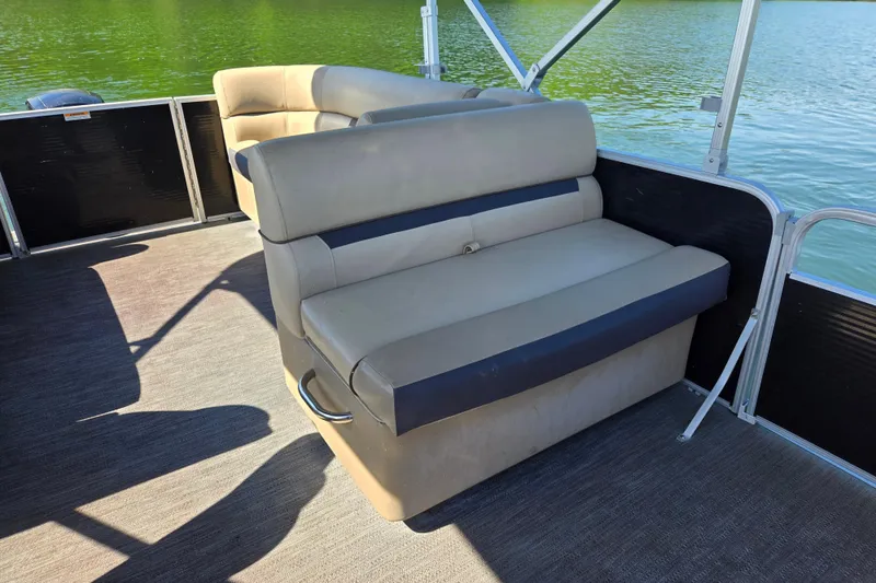 Slide: The Image of 2023 Godfrey Sweetwater 2286 C pontoon boat interior with comfortable seating by the water. - 13