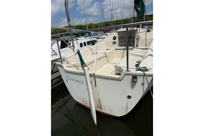 Slide: The Image of 1985 Hunter 25.5 sailboat named "Dulcinea" docked at a marina. - 7