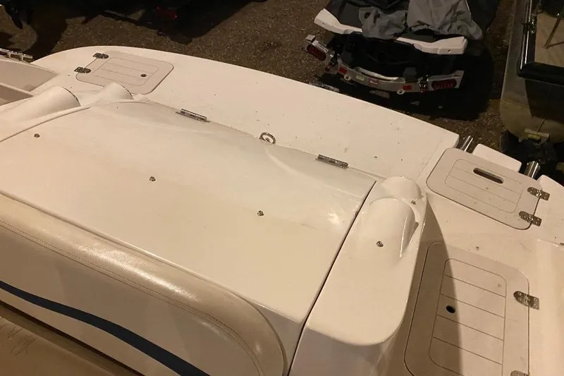 Slide: The Image of 2006 Starcraft 2000 IO Limited boat deck with storage compartments and seating area. - 11