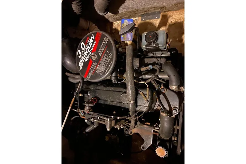 Slide: The Image of 2006 Starcraft 2000 IO Limited boat engine, featuring a 3.0L Mercury MerCruiser motor. - 16