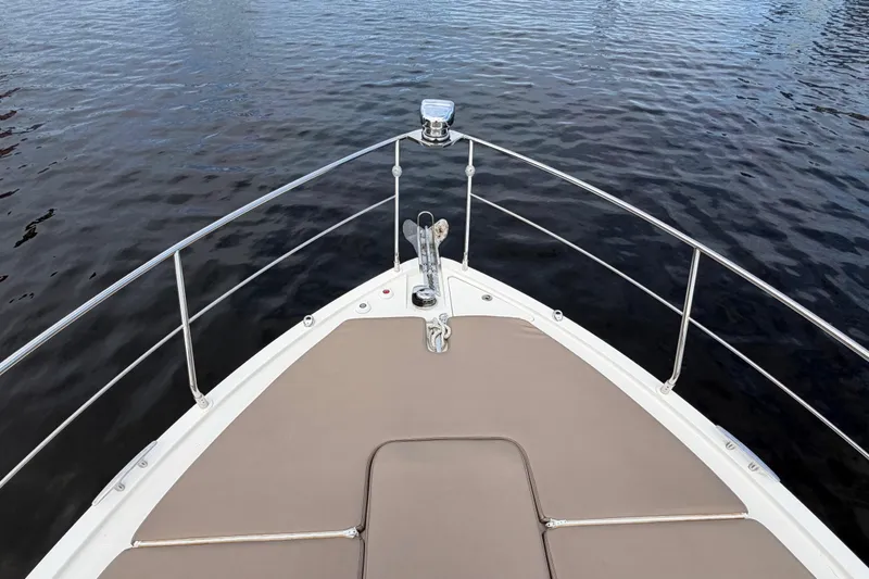 Slide: The Image of Bow view of 2019 Carver C34 yacht on calm water. - 10