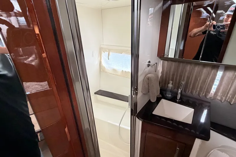 Slide: The Image of Luxurious bathroom in 2019 Carver C34 yacht with modern fixtures and elegant design. - 12