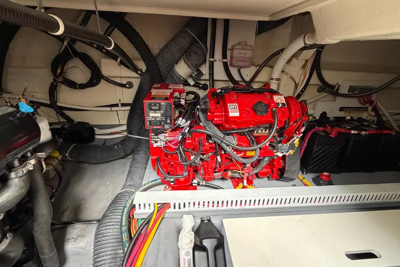Slide: The Image of Engine room of 2019 Carver C34 with red EFI engine and wiring. - 32