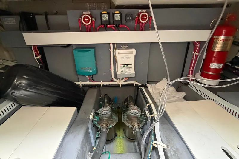 Slide: The Image of Engine room of a 2019 Carver C34 yacht, featuring mechanical and electrical components. - 34