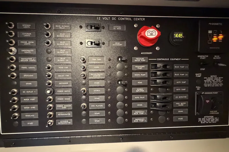 Slide: The Image of 2019 Carver C34 control panel with switches and indicators for various boat functions. - 38