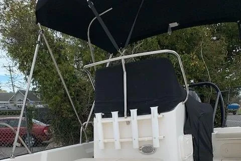 Slide: The Image of 2023 Boston Whaler 170 Montauk boat with canopy and rod holders. - 10