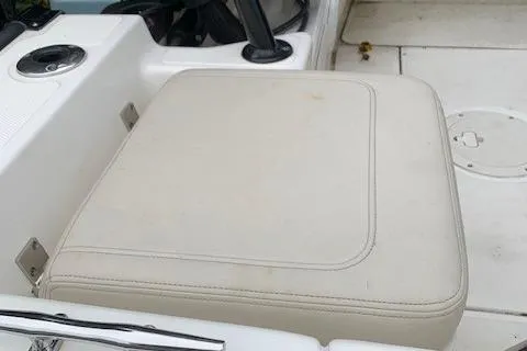 Slide: The Image of 2023 Boston Whaler 170 Montauk boat seat, featuring white cushioned upholstery. - 11