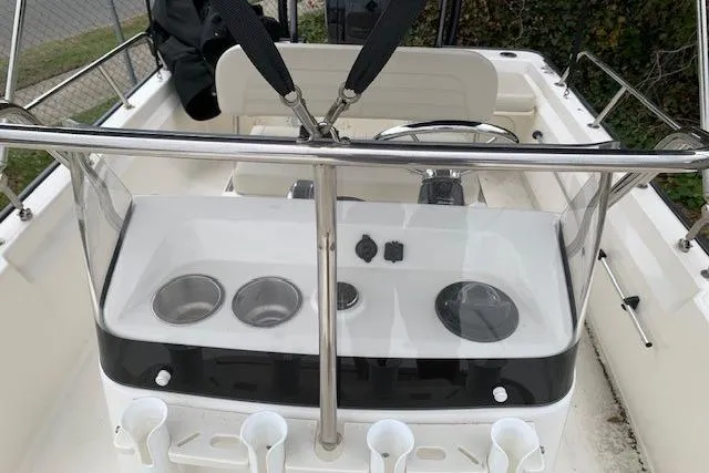Slide: The Image of 2023 Boston Whaler 170 Montauk boat console with steering wheel and cup holders. - 16