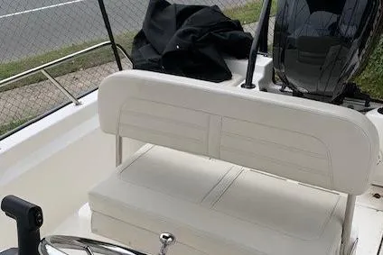Slide: The Image of 2023 Boston Whaler 170 Montauk boat interior with seating and steering wheel. - 17