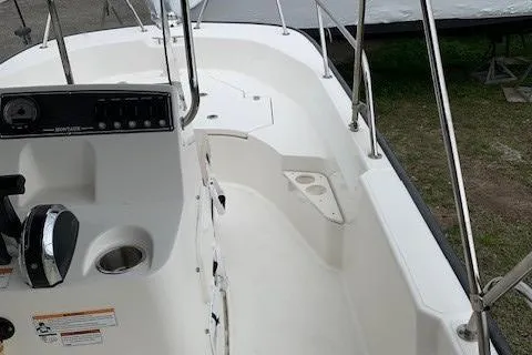 Slide: The Image of 2023 Boston Whaler 170 Montauk boat interior with steering console and seating area. - 22