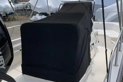 Slide: The Image of 2023 Boston Whaler 170 Montauk with cover at dock. - 3