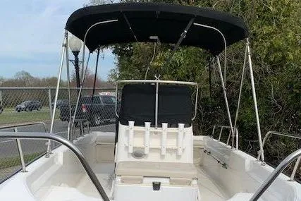 Slide: The Image of 2023 Boston Whaler 170 Montauk with Bimini top and seating area. - 6