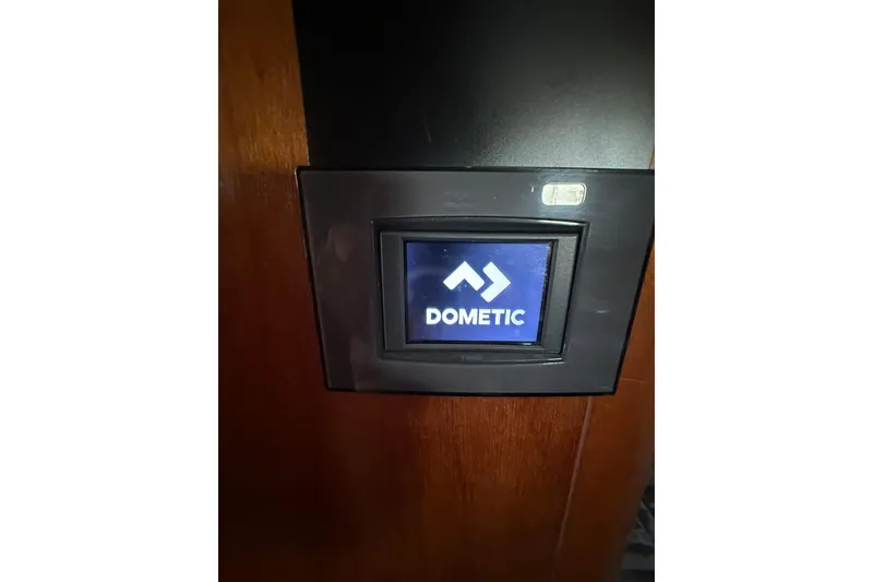 Slide: The Image of Dometic control panel on a 2000 Beneteau 50 yacht interior. - 103