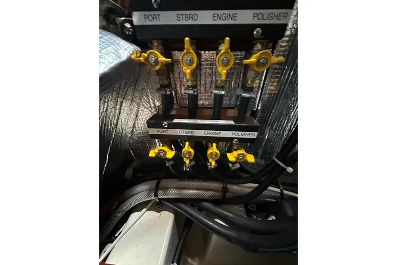 Slide: The Image of Fuel valve system on a 2000 Beneteau 50 yacht, labeled for port, starboard, engine, and polisher. - 106