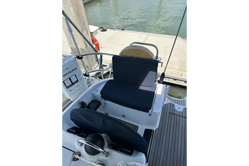 Slide: The Image of Cockpit of 2000 Beneteau 50 sailboat with seating and lifesaving equipment. - 11