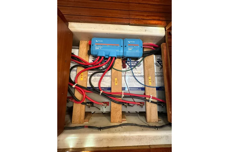 Slide: The Image of Electrical system of a 2000 Beneteau 50 yacht with batteries and wiring. - 112
