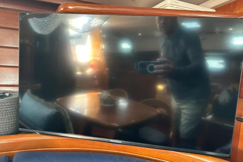 Slide: The Image of Reflection on Insignia TV screen inside a 2000 Beneteau 50 yacht cabin. - 116