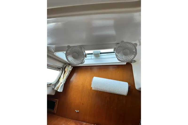 Slide: The Image of Interior of a 2000 Beneteau 50 yacht with fans and paper towel holder. - 118