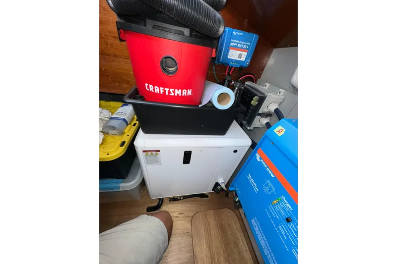 Slide: The Image of Engine room of 2000 Beneteau 50 yacht with Craftsman vacuum and electrical equipment. - 121