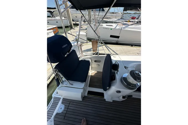 Slide: The Image of Cockpit of a 2000 Beneteau 50 sailboat with seating and steering wheel. - 14