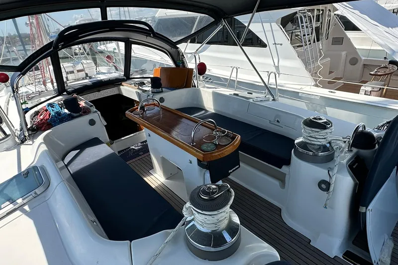 Slide: The Image of Cockpit of a 2000 Beneteau 50 sailboat, featuring seating and winches. - 16