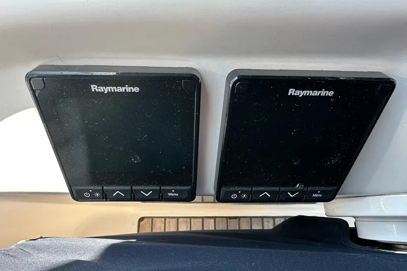 Slide: The Image of Raymarine navigation displays on a 2000 Beneteau 50 yacht dashboard. - 18