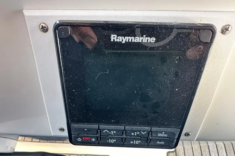 Slide: The Image of Raymarine navigation display on a 2000 Beneteau 50 yacht, showing control buttons. - 19