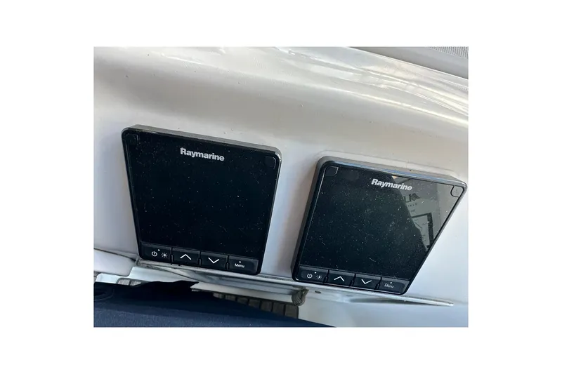 Slide: The Image of Raymarine navigation displays on a 2000 Beneteau 50 yacht dashboard. - 21