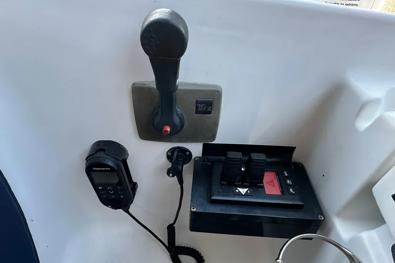 Slide: The Image of Control panel of a 2000 Beneteau 50 yacht with throttle and navigation equipment. - 22