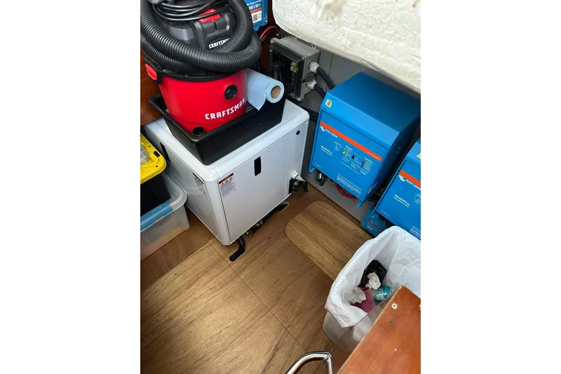 Slide: The Image of Engine room of 2000 Beneteau 50 yacht with equipment and storage. - 29