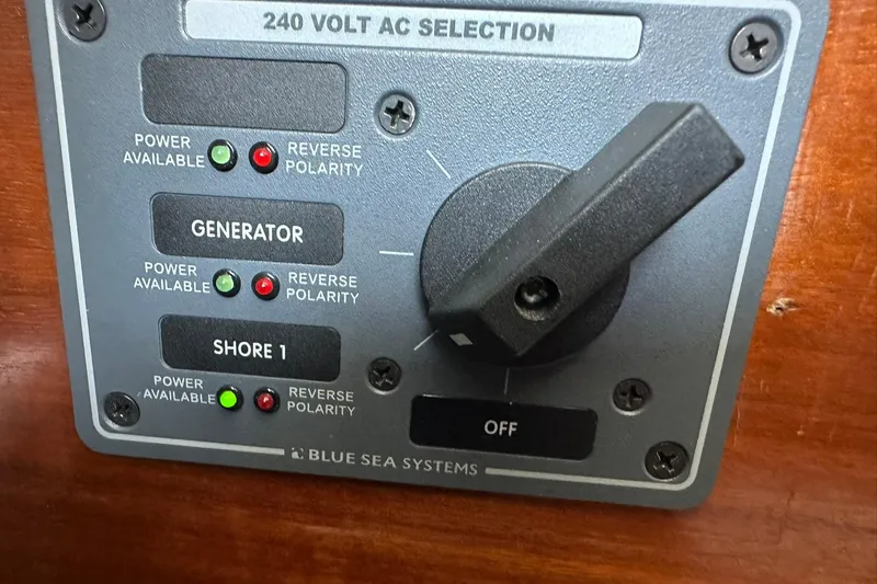 Slide: The Image of Control panel on a 2000 Beneteau 50 yacht, featuring 240V AC selection. - 30