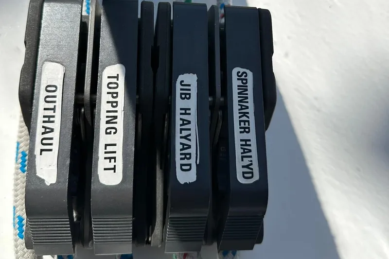 Slide: The Image of Close-up of labeled sailing cleats on a 2000 Beneteau 50 yacht. - 36