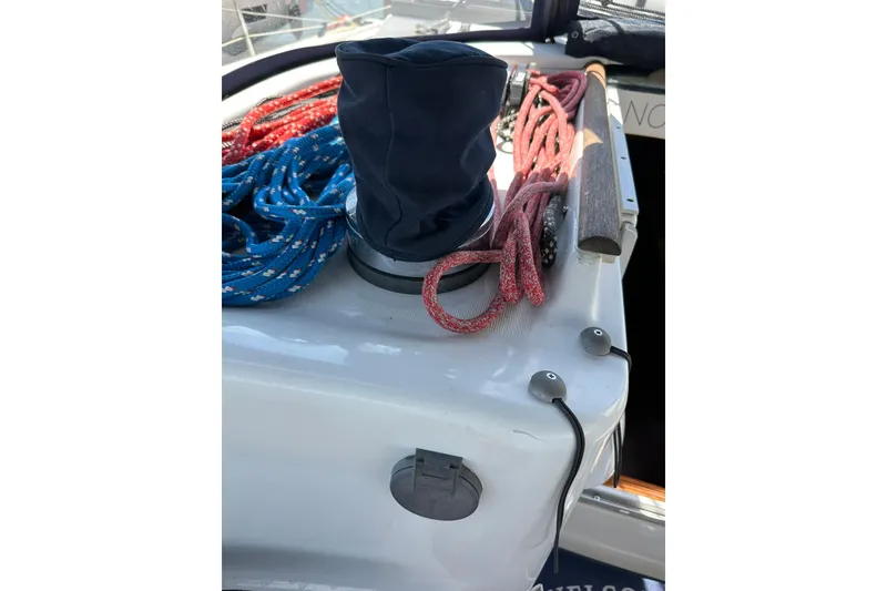 Slide: The Image of Beneteau 50 sailboat deck with ropes and winch, 2000 model. - 38