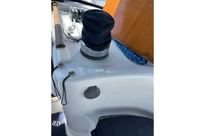 Slide: The Image of Deck view of a 2000 Beneteau 50 sailboat, featuring winch and ropes. - 39