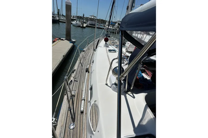 Slide: The Image of 2000 Beneteau 50 sailboat docked at marina, showcasing deck and rigging details. - 40