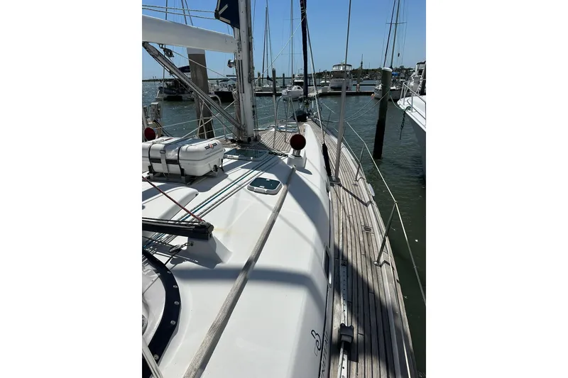 Slide: The Image of Sailing yacht Beneteau 50, 2000 model, docked at marina with clear skies. - 44