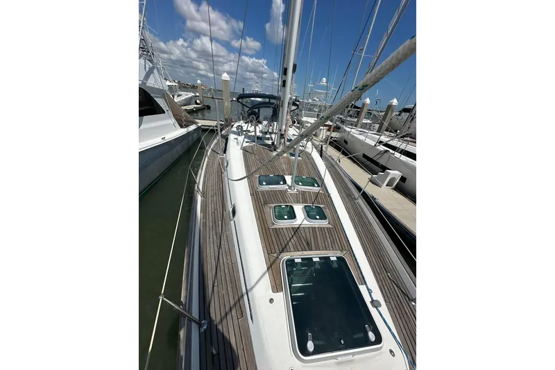 Slide: The Image of Sailing yacht Beneteau 50, 2000 model, docked at marina with clear sky. - 47